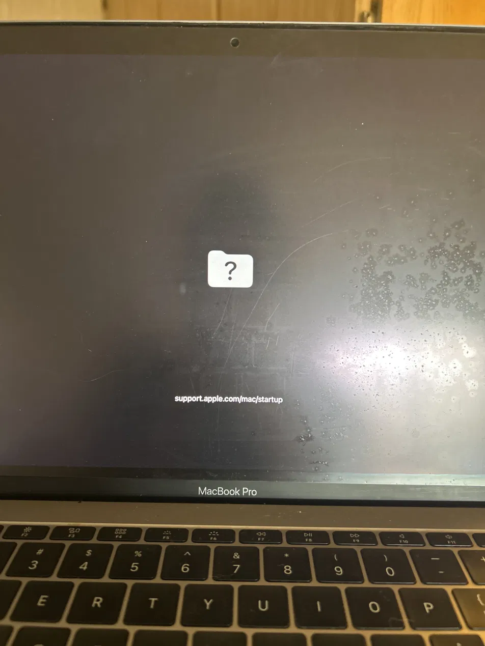 MacBook Pro showing flashing question mark folder — startup disk not found