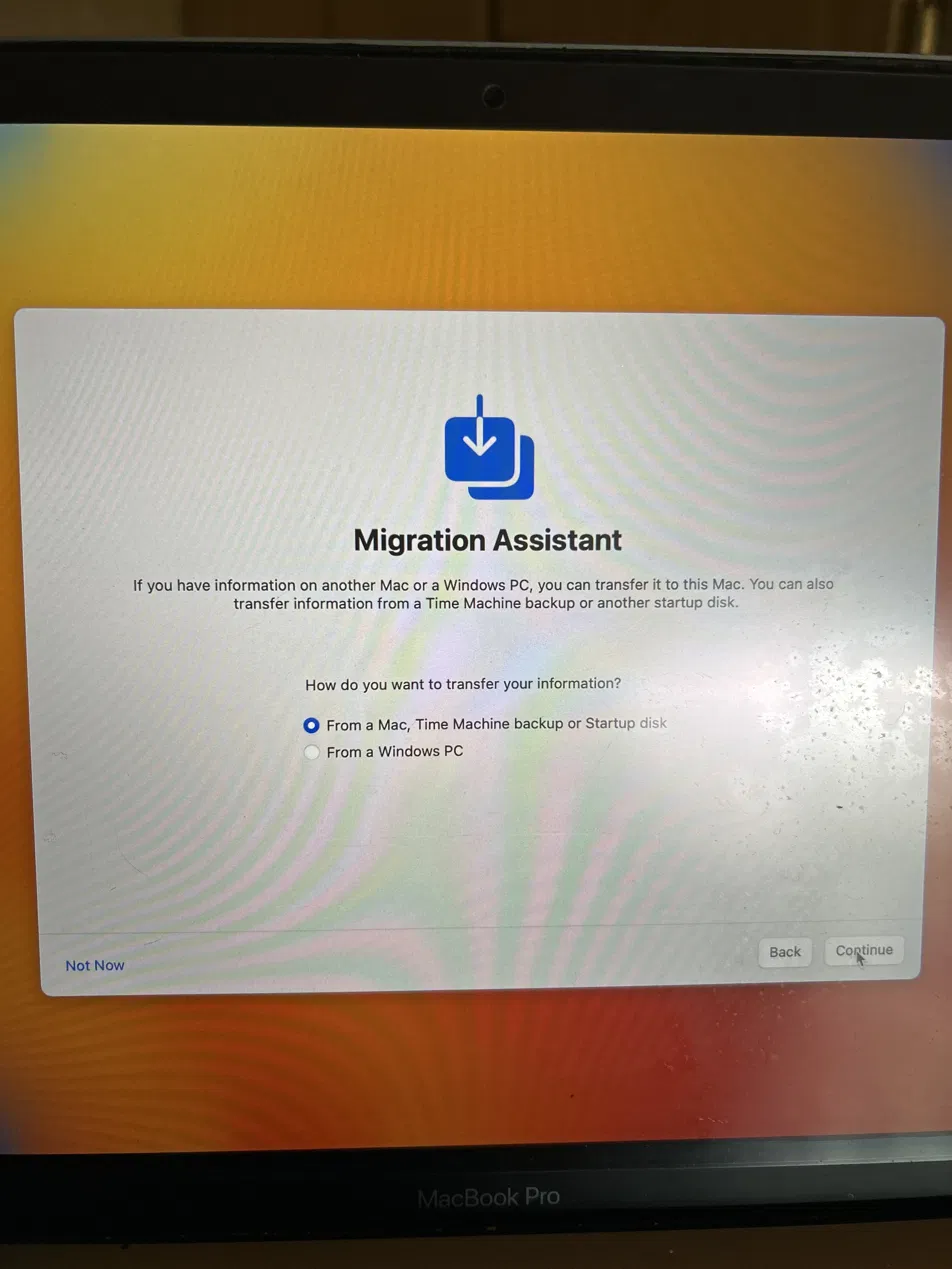 Migration Assistant screen confirming macOS reinstall completed successfully